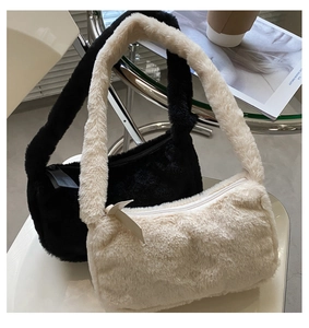 Detail of plush faux fur shoulder bags in black and beige with soft texture close-up