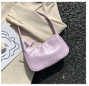 Close-up of a light purple baguette shoulder bag with sleek synthetic leather and top zipper