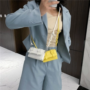 Mini candy-colored PU leather crossbody bags in white and yellow with chunky chain straps