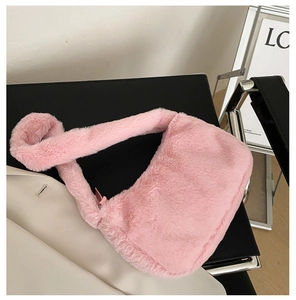 Detailed macro view showing the soft texture of the pink faux fur on the shoulder bag