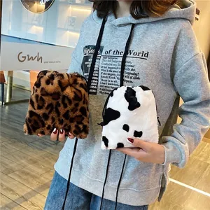 Chic leopard and cow print faux fur bucket bags with drawstring shoulder straps