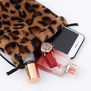 Faux fur leopard print bucket bag with drawstring closure showing storage capacity