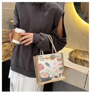 Detail of canvas and jute tote bag featuring summer themed illustrations and coffee graphics