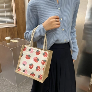 Minimalist canvas and jute tote bag with strawberry print and rope handles