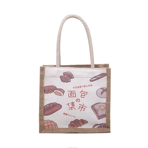 Large canvas tote bag with bread illustrations and brown rustic linen sides