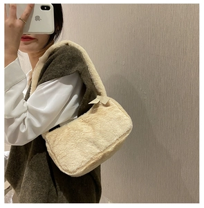 Detail showing the cream plush shoulder bag texture and side view for autumn winter