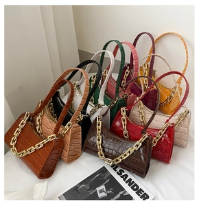 Collection of crocodile pattern underarm bags in various colors with gold chain straps