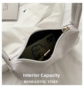 Internal view showing the capacity of this white crocodile pattern shoulder bag