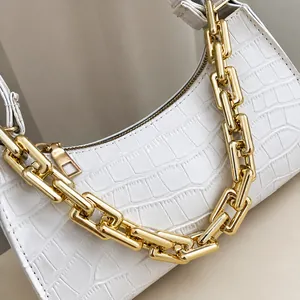 Detailed view of white crocodile texture PU leather handbag with thick gold chain link