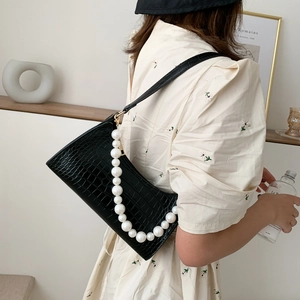 Chic black crocodile pattern underarm bag with elegant pearl strap and long leather strap