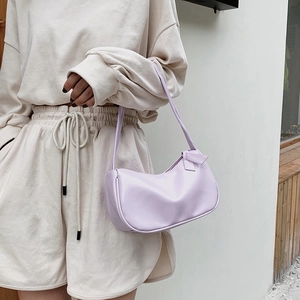 Minimalist lavender PU leather hobo shoulder bag with zipper closure shown on a model