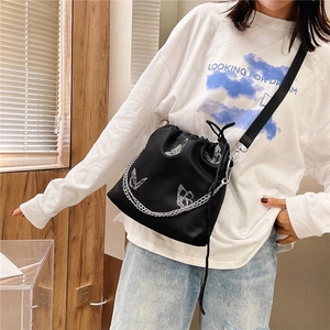 Fashionable black drawstring bucket bag with white butterfly prints and silver metal chain