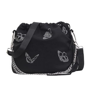 Women's black nylon bucket bag with silver butterfly patterns and a stylish metal chain