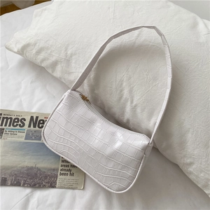 Minimalist white crocodile embossed faux leather underarm bag with gold zipper detail