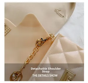 Detail showing the detachable golden chain strap and quilted cream jelly bag texture