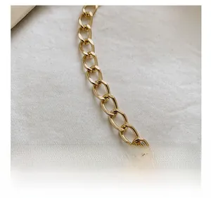 Detailed close-up of a premium gold metal chain strap featuring flat oval links