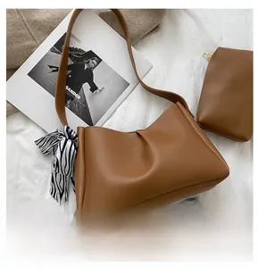 Brown leather tote bag set with zebra print scarf and small pouch for size reference