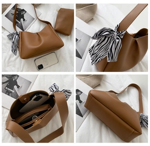 Brown soft leather shoulder bag detail with zebra pattern scarf and matching coin pouch