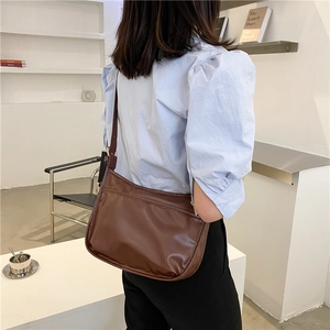 Minimalist deep brown baguette shoulder bag in glossy PU leather for women