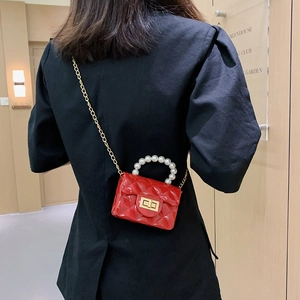 Mini red pearl jelly handbag with quilted lattice pattern and golden chain strap