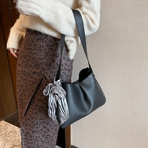 Minimalist black leather shoulder bag with zebra print scarf for women's office fashion
