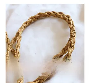 Close-up of woven shoulder strap texture made of natural brown straw material