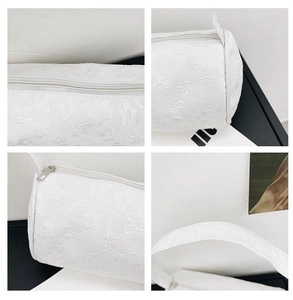 Detailed views of white cylinder bag featuring 3D flower jacquard texture and silver zipper