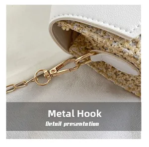Macro detail of golden metal hook and woven PU leather splicing on a shoulder bag