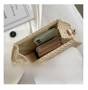 Internal view of the woven PU bag showing storage space for a phone and wallet