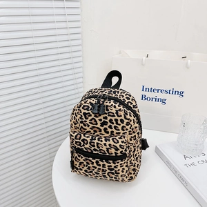 Cute cow pattern canvas backpack for students with trendy leopard print details