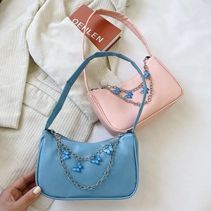 Fashionable butterfly chain baguette underarm bags in sky blue and cherry blossom pink colors