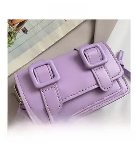 Detail view of the purple PU leather square bag with dual buckles and resin chain strap