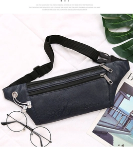 Close-up of leather waist bag with three zip pockets and functional earphone port