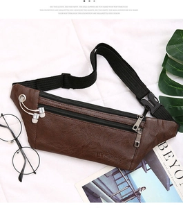 Detailed view of brown leather waist bag with earphone port and dual zipper storage
