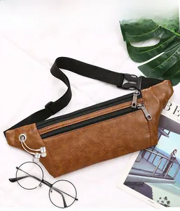 Brown PU leather chest bag detail showing side earphone port and adjustable nylon strap