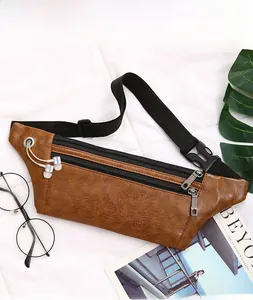 Brown leather waist bag with lychee texture featuring headphone hole and double zippers