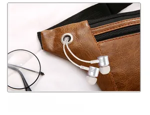 Detail of lychee pattern leather waist bag featuring a metal headphone jack port