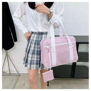Pink JK style travel bag detail showing the heart-shaped clear window and accessory