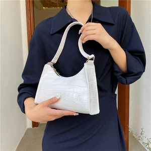 White faux leather baguette bag with crocodile pattern texture and retro half-moon shape