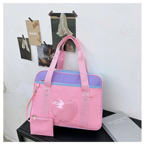 Pink and purple canvas travel bag with heart-shaped window and small side pouch
