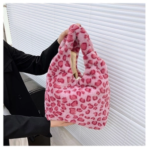 Detailed view of pink leopard print plush handbag with soft faux fur texture
