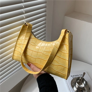 Fashionable bright yellow crocodile texture underarm bag with a sleek minimalist design