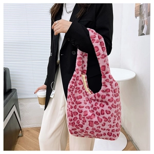 Pink leopard print faux fur tote bag styled with a casual black blazer outfit