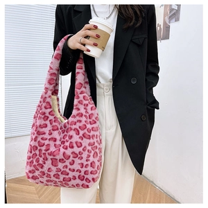 Detail of pink leopard faux fur tote bag showing soft plush texture and large capacity