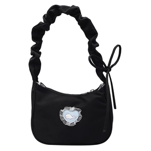 Minimalist black nylon shoulder bag with ruffled strap and heart whale patch design