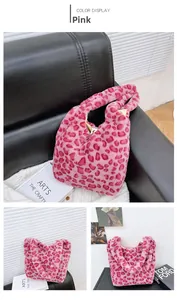 Detail of pink leopard plush tote bag featuring fluffy texture and integrated wide handle