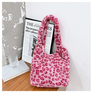 Detail of pink leopard print faux fur tote bag with soft texture and chic plush pattern