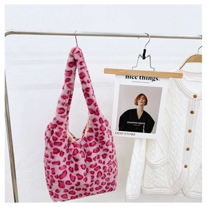 Detail view of pink leopard print plush tote bag with soft faux fur texture and lining