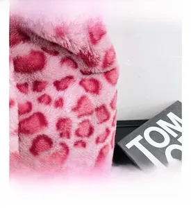 Close-up of pink leopard print faux fur texture on a stylish trendy shoulder bag