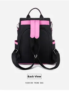 Rear view of black and pink color-block fashion backpack with adjustable straps and side pockets